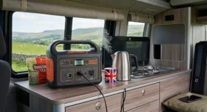 Small portable power unit boiling a low-wattage travel kettle inside a modern British campervan.