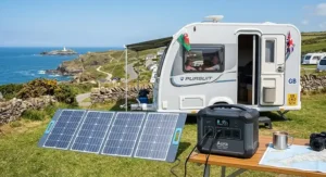 Folding solar panel charging a portable power station under 300Wh outside a caravan parked on the Cornish coast.